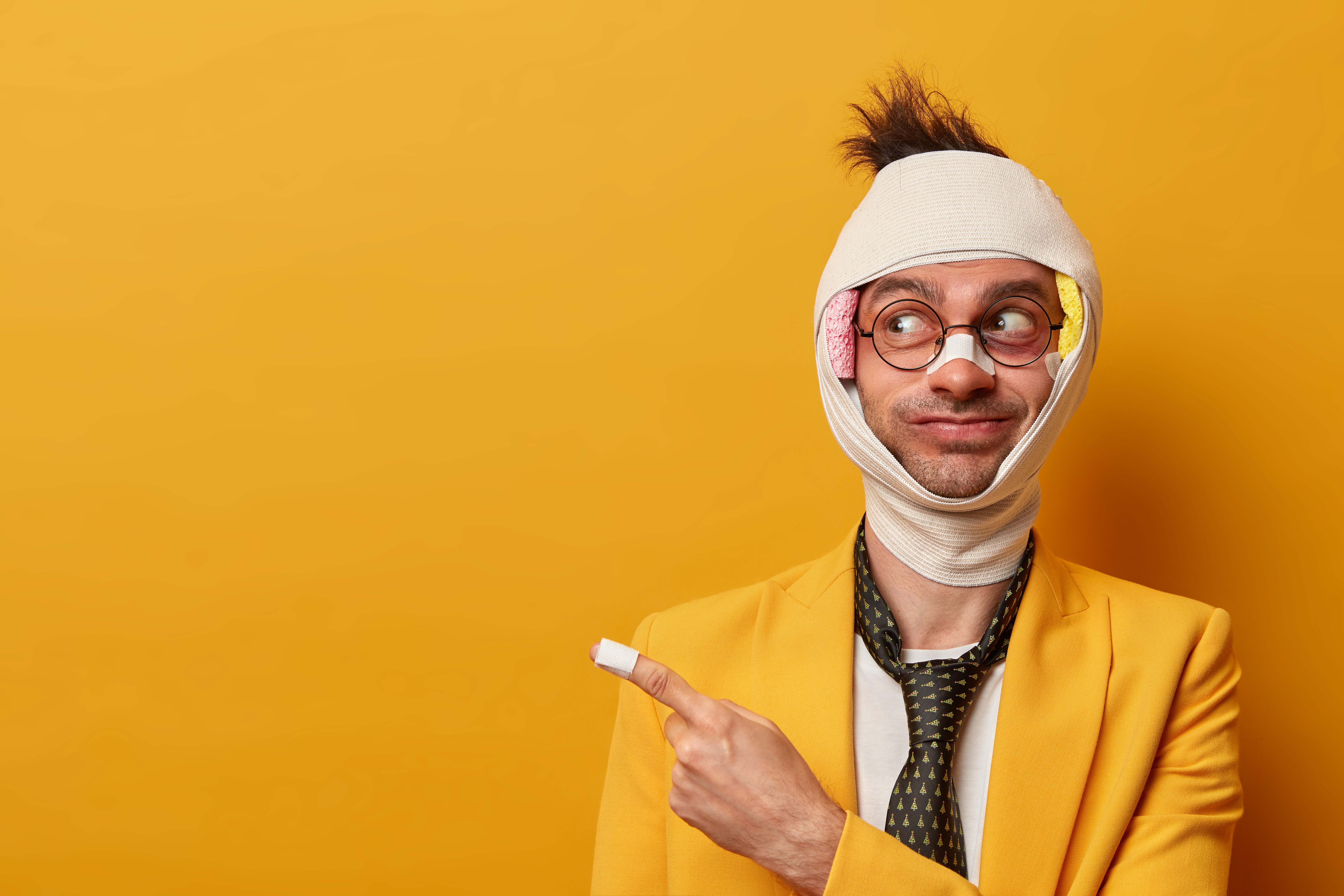 close-up-injured-man-with-dark-bruise-eyes-brain-concussion-wears-bandage